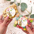 Personalised popcorn bag with floral bunny tag and pastel crunchy popcorn inside