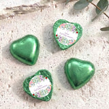 Green foil-covered chocolate hearts, three hearts with personalised First Holy Communion label