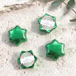 Green star-shaped foil-covered chocolate favors with floral First Communion label