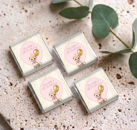 Set of four mini chocolate packets with pink “5th Birthday” labels and bunny illustrations
