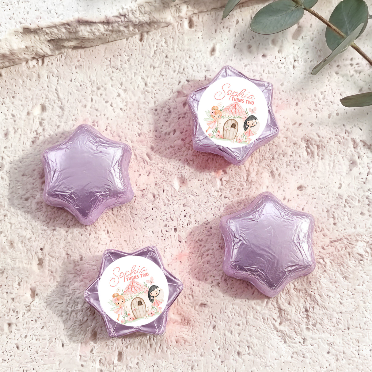 Purple foil star chocolate with “Sophia turns two” label