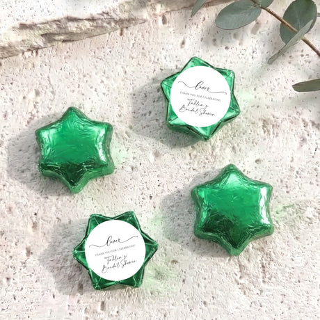 Star-shaped foil-wrapped chocolates with 'Love' label, green