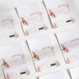 Printed chocolate wrappers with boho roses and cross motifs for christening, white background