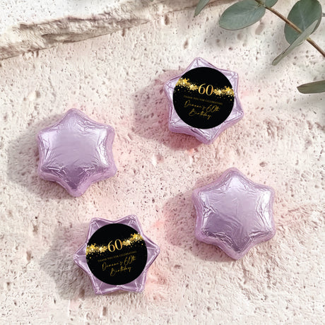 60th birthday star chocolates with lilac/purple foil-covered stars and black-and-gold 60 badge