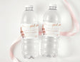 Boho rose confirmation water bottle labels on two clear plastic bottles, pink ribbon, gold text