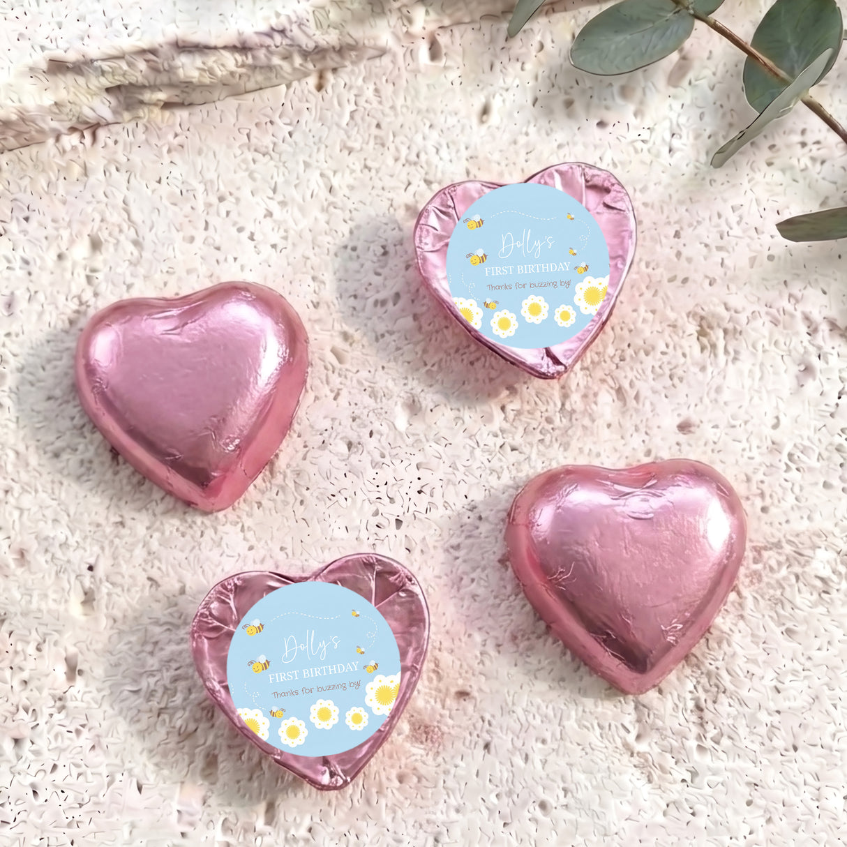 Pink foil-covered chocolate heart with birthday label, heart-shaped foil.
