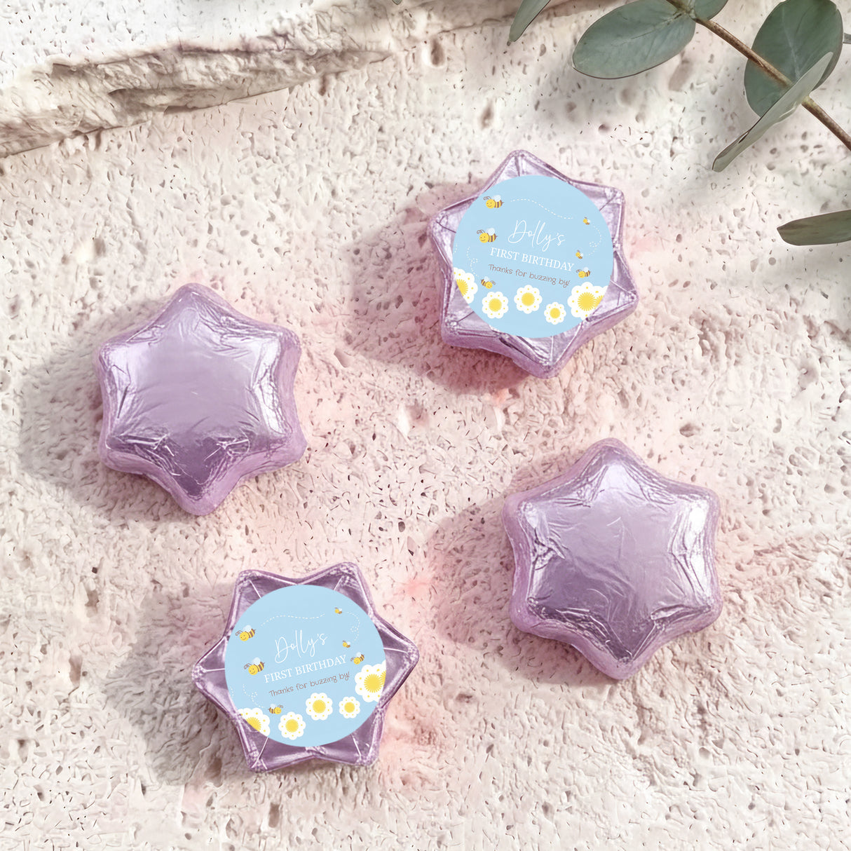 Lilac and light blue foil chocolate stars, one has a personalised printed label