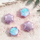 Purple foil-wrapped chocolate stars, six-point shapes with blue center label.