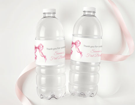 Personalised water bottle labels with pink bows and thank-you birthday text on clear bottles