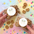 Personalised pretzel bag with pretzels inside and round First Communion cross floral sticker
