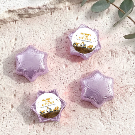 Foil-covered chocolate star sweets in pale purple, with birthday foil label