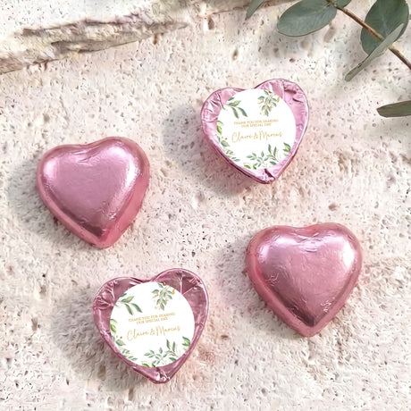 Personalised foil-covered chocolate hearts, pink with printed gift message circle