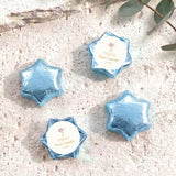 Blue foil-covered chocolate star favors with white personalised label