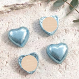 Foil-covered chocolate hearts, light blue, with round personalised message label