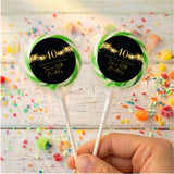 Personalised 40th birthday lollipops with green ring toppers and black-and-gold design