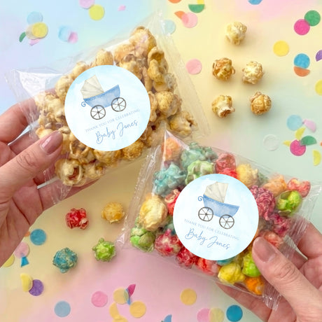 Personalized baby carriage pretzel bag set: clear bags with colorful pretzels and blue label
