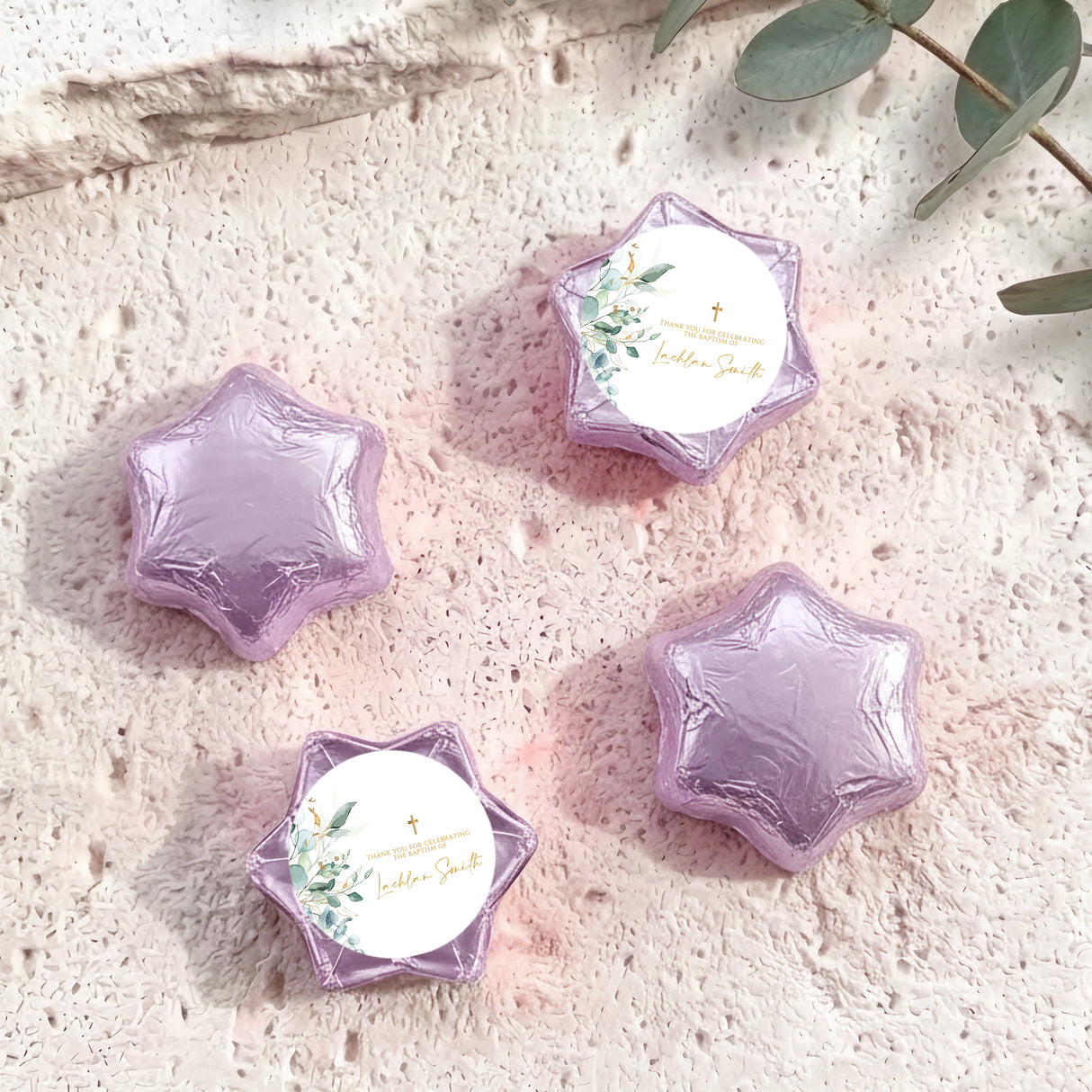 Foil-wrapped chocolate stars in purple with gold cross, set of four