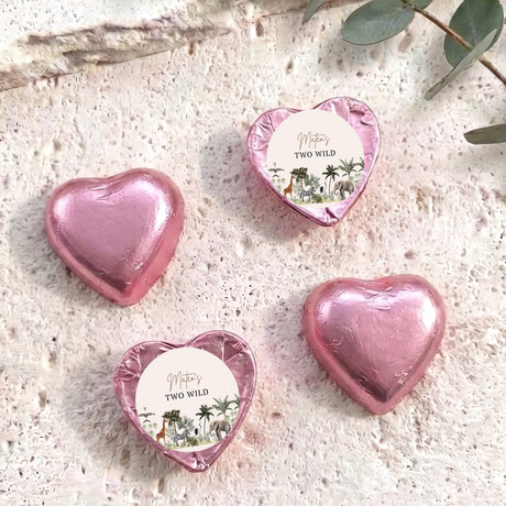 Foil-covered chocolate hearts, pink heart foil with circular jungle scene labels