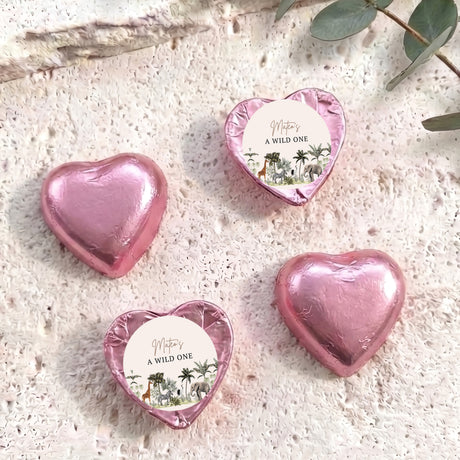 Pink foil-covered chocolate hearts with white 'A WILD ONE' label