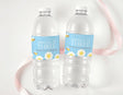 Personalised water bottle labels on clear bottles, blue strip reading AMELIA IS THREE