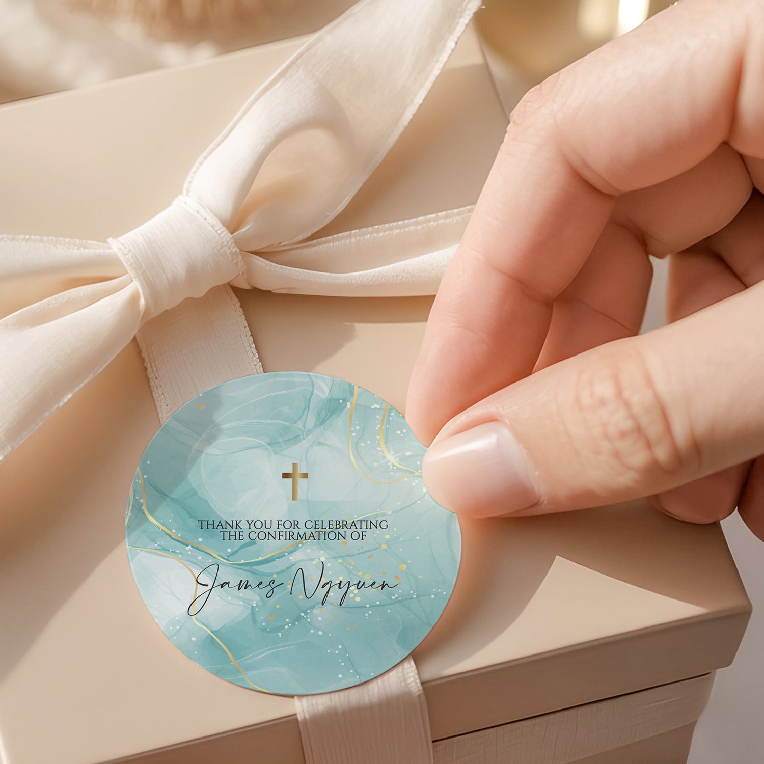 Round blue confirmation label with gold cross and thank-you text on ribbon
