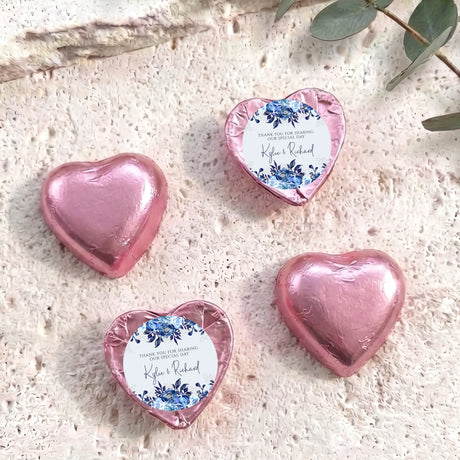 Foil-covered chocolate hearts, pink with blue floral message labels