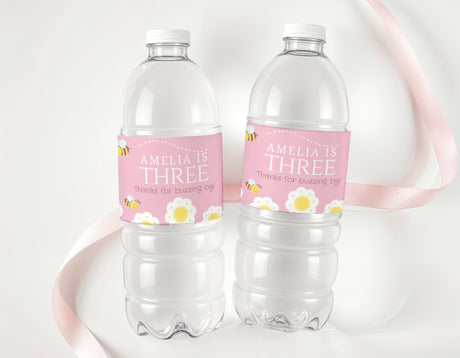 Personalised pink birthday labels with name and age on clear drink bottles