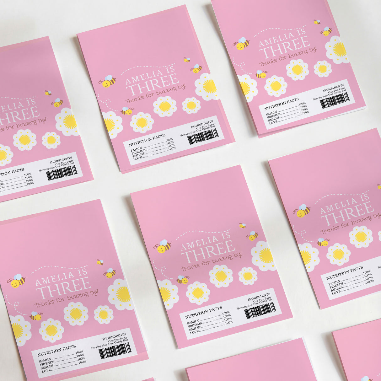 Pink chocolate wrappers, bee and flower print with Amelia's Three text