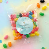 Confirmation jelly bean bags with blue round label, gold cross, filled with assorted candies