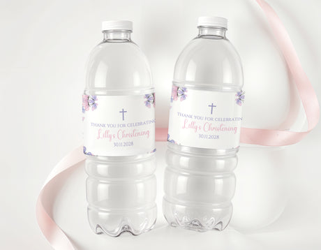 Purple butterfly christening water bottle labels on two clear drink bottles
