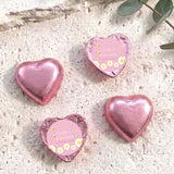 Pink foil heart chocolates with personalised baby-bee shower label on two hearts