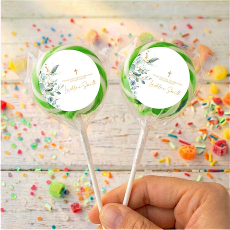 Personalised baptism lollipops: two green-edged white labels, floral cross design