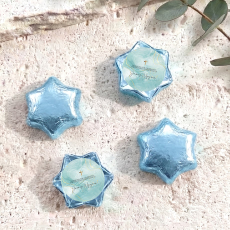 Blue foil star chocolates with cross label, set of four foil-wrapped stars