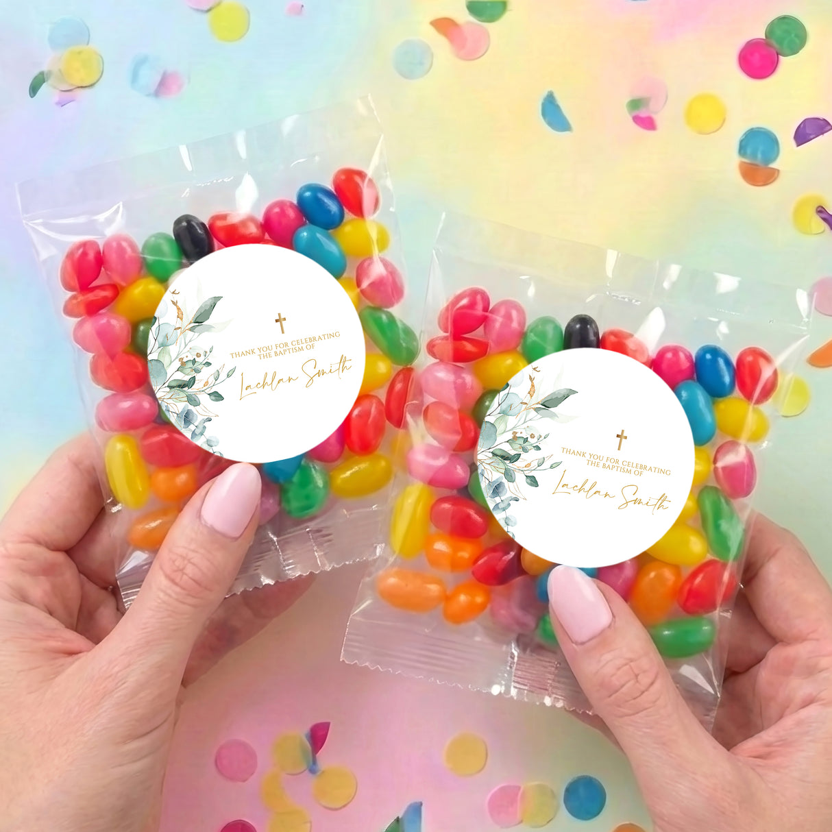 Two personalised jelly bean bags with round baptism labels, gold cross, assorted candies