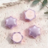 Purple foil-covered chocolate stars with cross logo medallion
