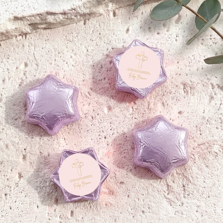 Lilac/purple foil chocolate stars with round personalised label and cross emblem