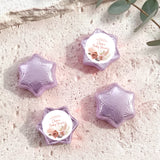 Purple/lavender foil-covered chocolate stars with round 'Baby Shower' label