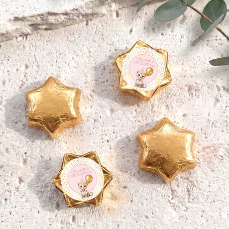 Gold foil star chocolates with a small birthday card label on one star