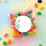 Personalised jelly bean bag with round baptism label and gold cross, assorted colorful candies