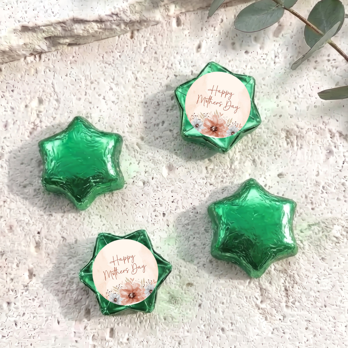 Green foil-covered chocolate stars with a “Happy Mother’s Day” label card