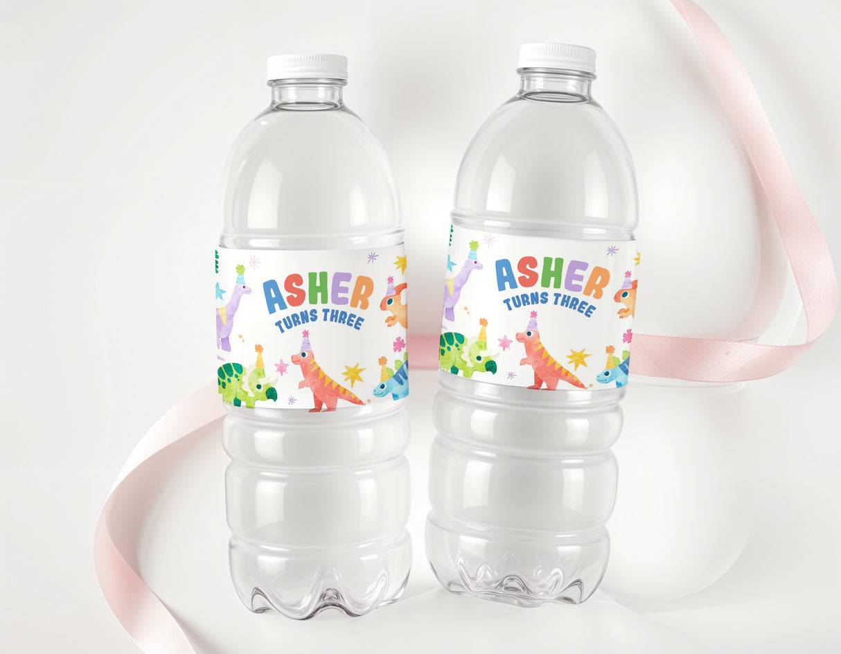 Personalised dinosaur water bottle labels: Asher, turns three, on two clear bottles