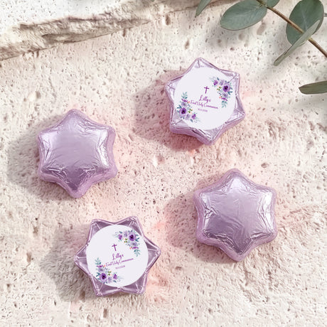 Pink-purple foil chocolate stars with floral cross Communion label on one star