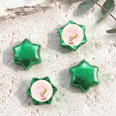 Green foil star chocolates with a small birthday card label on one star