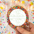 Personalised christening gift bag with rainbow bead wreath and round white label