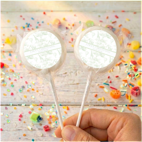 Personalized christening lollipops with white ribbon accents and clear wrappers