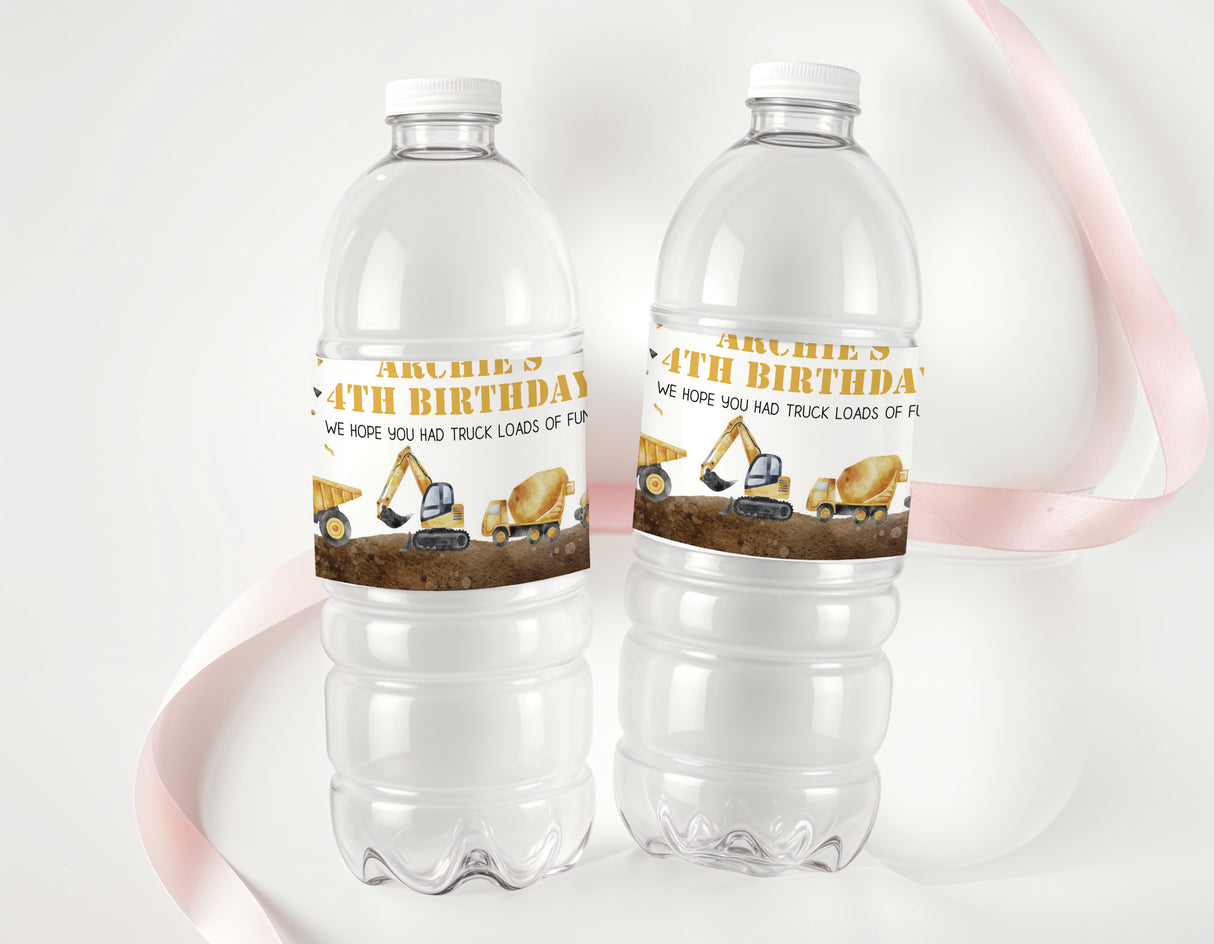 Two clear plastic water bottles with construction 4th birthday labels