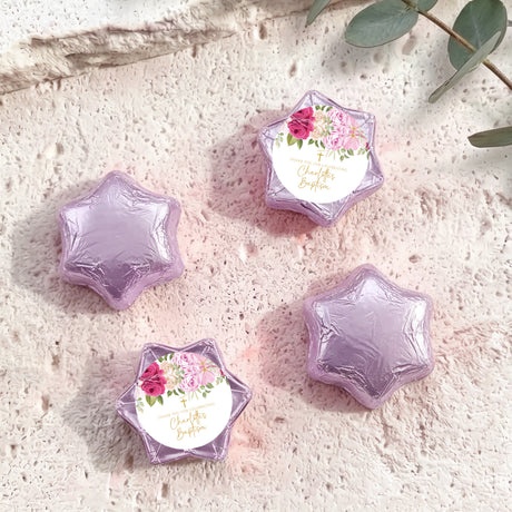Foil-covered chocolate stars with floral personalized label, lavender foil shapes