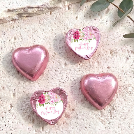 Pink foil-covered heart chocolates with floral 'Happy Mother's Day' message