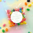 Colorful jelly bean keepsake bag with round white label, sealed in clear cellophane