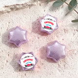 Lavender foil-covered star chocolates with personalised label wrappers, four pieces shown